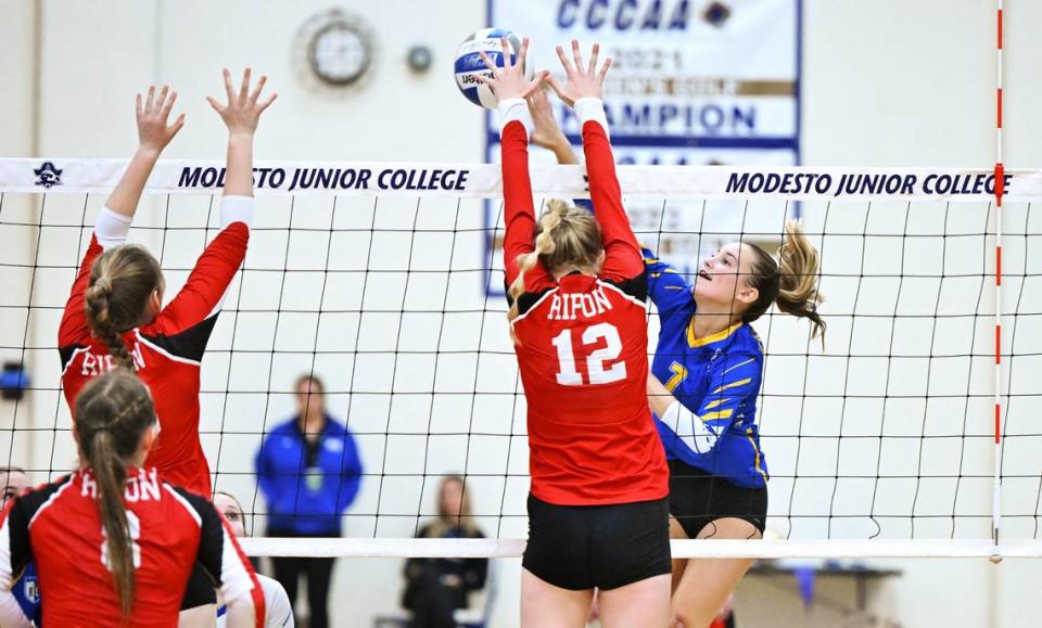 Ripon Christian’s Jordan Vander Veen spikes the ball past Ripon’s Katherine Eskes (12) during the Sac-Joaquin Section Division IV championship match at Modesto Junior College in Modesto, Calif., Saturday, Nov. 4, 2023. Ripon Christian won the match 3-0. Andy Alfaro/aalfaro@modbee.com