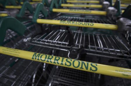 Shopping trolleys are seen outside of a branch of the food retailer Morrisons in west London, Britain, January 7, 2017. REUTERS/Toby Melville