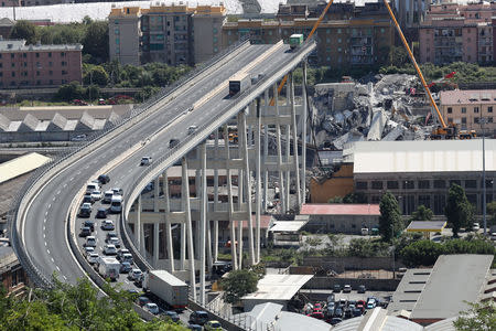 FILE PHOTO: The collapsed Morandi Bridge in the Italian port city of Genoa, Italy, August 16, 2018. REUTERS/Stefano Rellandini/File Photo