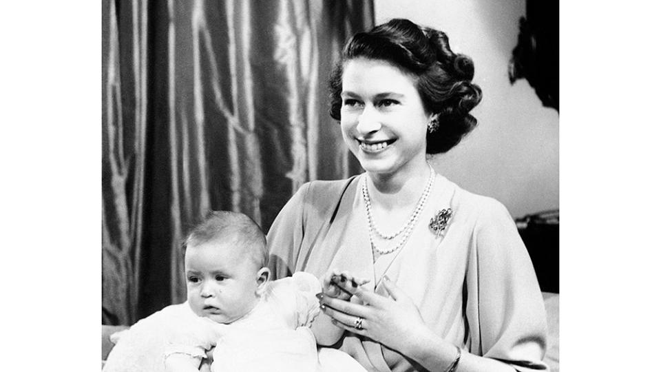 A portrait of then-Princess Elizabeth and baby Charles in 1949 - Credit: Associated Press