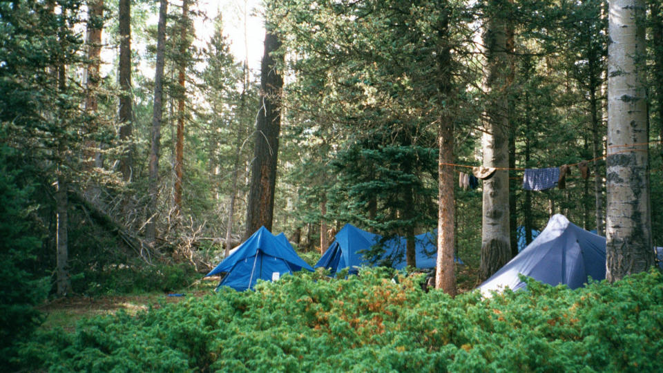 FILE - In this July 2001 file photo, a campsite setup off the trail to the summit of the second highest peak in Philmont Scout Ranch, N.M., is shown. The vast Philmont Scout Ranch, one of the most spectacular properties owned by the financially struggling Boy Scouts of America, has been mortgaged by the BSA, according to member of Philmont’s oversight committee. (AP Photo/Ira Dreyfuss, File )