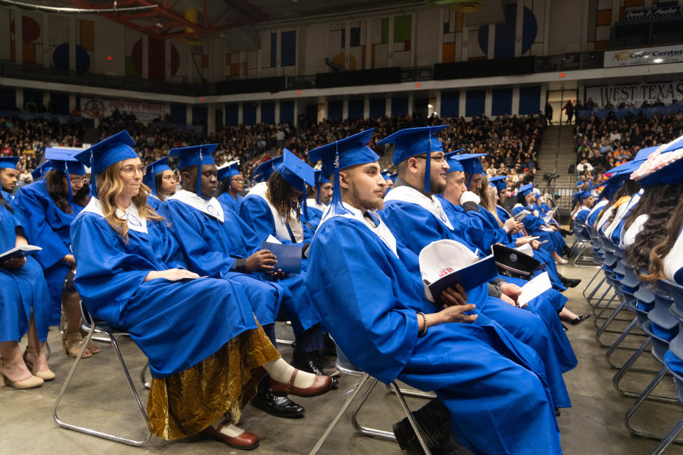 A group of graduates await their turn to walk the stage at Amarillo College's commencement ceremony in December at the Amariilo Civic Center.