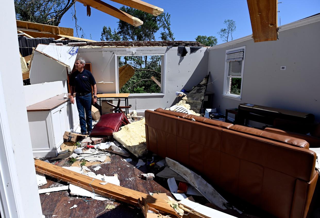 Gov. Bill Lee surveys a storm damaged home on Blackburn Lane Thursday, May 9, 2024, in Columbia, Tenn. Severe weather and tornadoes caused damage in Tennessee on Wednesday.