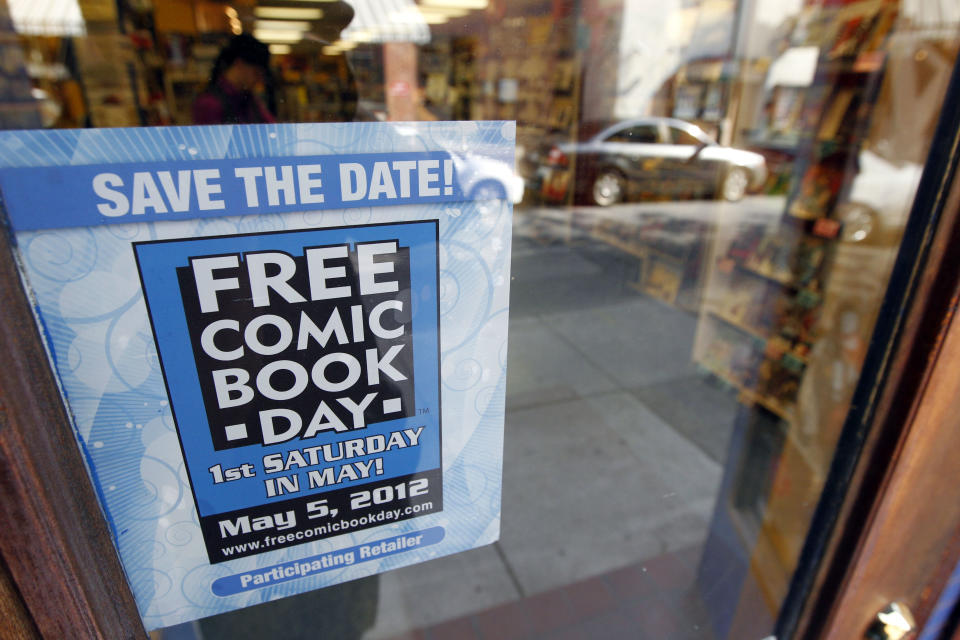 Shown is an advertisement for Free Comic Book Day at Fat Jack’s Comicrypt, Friday, May 4, 2012, in Philadelphia. Like hundreds of other comic specialty shops in 46 countries, the store is participating in Free Comic Book day on Saturday, May 5, which sees shops give away free copies of new and reprinted comics from some 40 publishers, including Marvel, DC, Archie, Image, Dark Horse, Valiant and Dynamite, among others, to promote the growth of the medium and garner new readers, some of whom may have been exposed to heroes through television and films. Free Comic Book day started 11 years and continues to expand, said Joe Field, who helped organize the inaugural event. This year, some 3.5 million free comics will be handed out. (AP Photo/Matt Rourke)