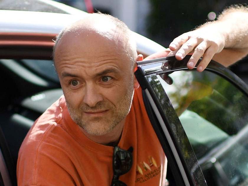 Number 10 Downing Street special advisor Dominic Cummings gets out of his car as he arrives at his home in London on 23 May 2020 after allegations he broke coronavirus lockdown rules by travelling across the country in March: AFP via Getty Images