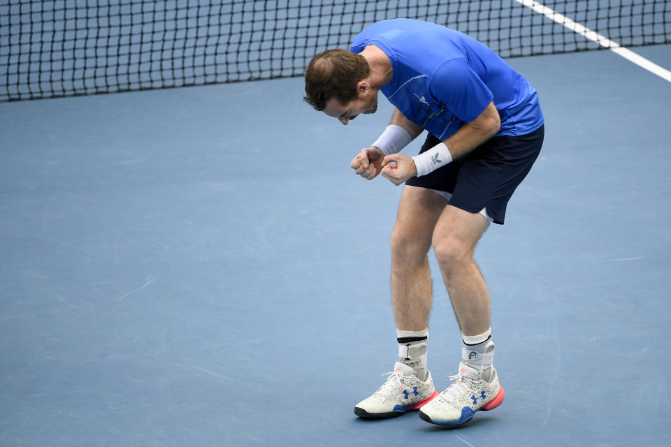 Andy Murray of Britain reacts after defeating Nikoloz Basilashvili of Georgia in their first round match at the Australian Open tennis championships in Melbourne, Australia, Tuesday, Jan. 18, 2022. (AP Photo/Andy Brownbill)