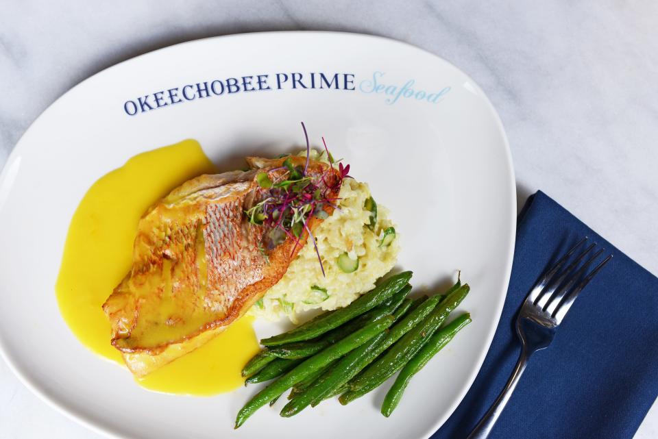 Red snapper with saffron velouté is served over asparagus risotto at the new Okeechobee Prime Seafood restaurant in West Palm Beach.