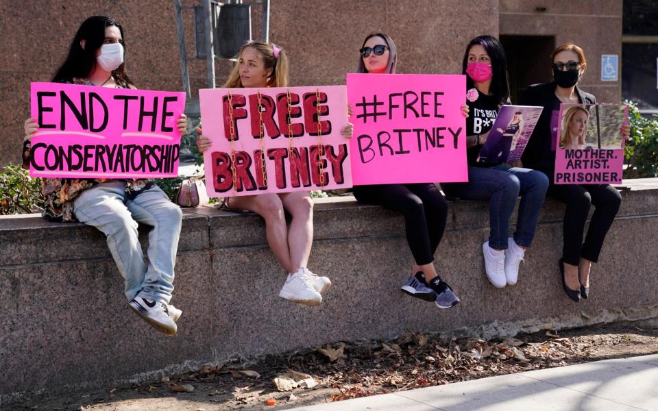 Britney Spears supporters gather outside a court hearing concerning the pop singer's conservatorship at the Stanley Mosk Courthouse - Chris Pizzello/AP