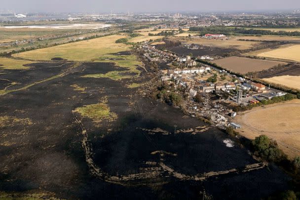 PHOTO: The scene after a wildfire blaze in the village of Wennington, east London, July 20, 2022. (Aaron Chown/PA via AP)