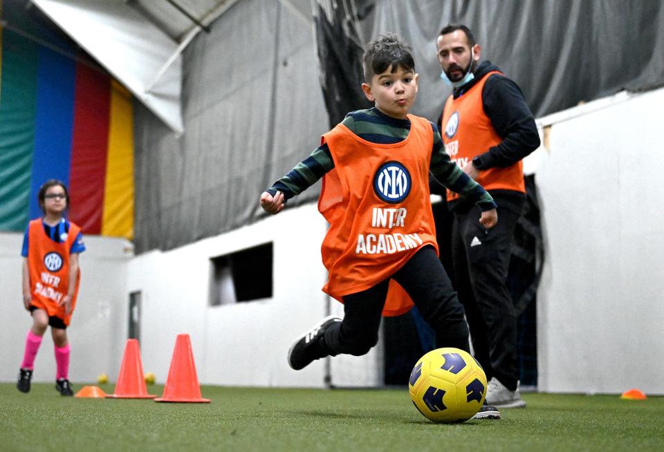 Hugh Radhakrishnan, 6, of Natick kicks the ball during a Inter Academy Metro West Boston soccer practice at SMOC's Community and Cultural Center in Framingham, April 6, 2022. The practice was led by Luigi Mainolfi, a coach from an elite youth soccer academy in Milan, Italy, and Inter Academy MetroWest Boston instructor Juan Erazo of Westborough.