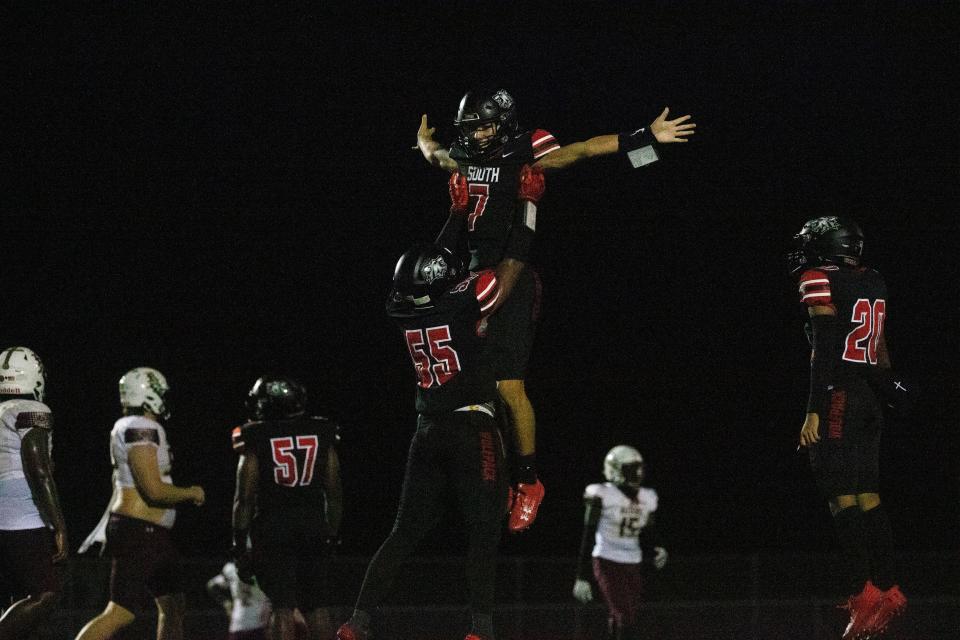 Chase Enguita, the quarterback for the South Fort Myers High School football team (#7) celebrates after scoring a touchdown against Riverdale on Friday, Sept. 1, 2023. South Fort Myers won. (Andrew West/The News-Press a part of the USA Today Network)