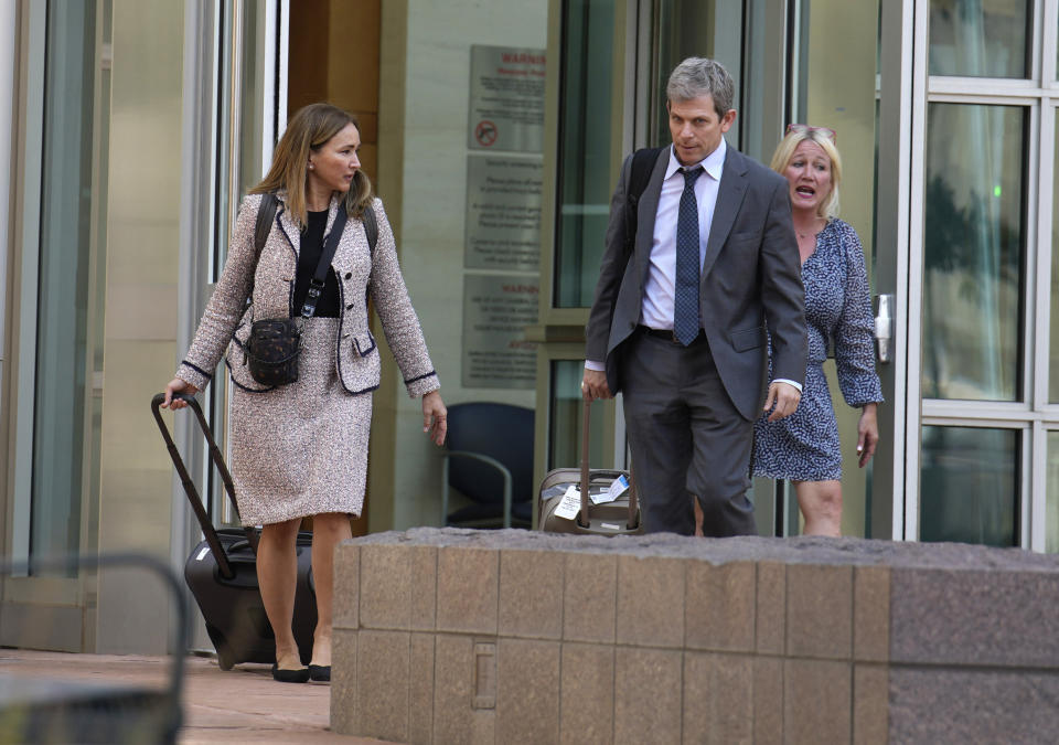 Margot Moss, left, and her co-counsel, David Oscar Markus, exit the federal courthouse after a judge handed down a sentence of life in prison and more than $15 million in penalties to their client, Larry Rudolph, the wealthy owner of a Pittsburgh-area dental franchise, for killing his wife at the end of an African safari in Zambia, during a sentencing hearing Monday, Aug. 21, 2023, in the federal courthouse in Denver. (AP Photo/David Zalubowski)