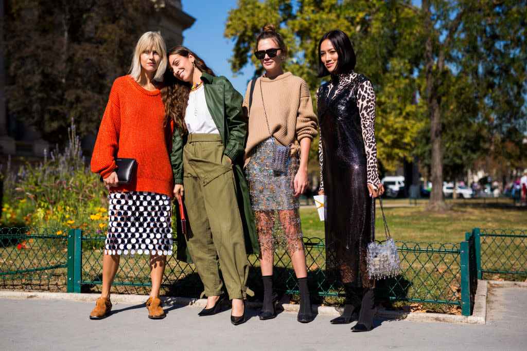 From left, influencers Linda Tol, Erika Boldrin and Tiffany Hsu (with a friend) at the Paco Rabanne fashion show in September in Paris. (Photo: Claudio Lavenia/Getty Images)