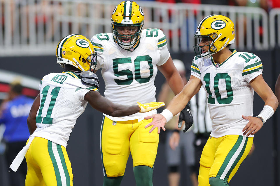 ATLANTA, GEORGIA – SEPTEMBER 17: Jayden Reed #11 of the Green Bay Packers celebrates a touchdown with Jordan Love #10 during the second quarter in the game against the Atlanta Falcons at Mercedes-Benz Stadium on September 17, 2023 in Atlanta, Georgia. (Photo by Kevin C. Cox/Getty Images)