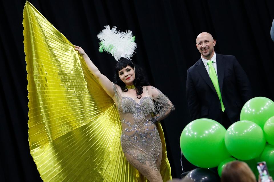 Ghost Pirates CEO and majority owner Andy Kaufmann stands on stage with a showgirl during the event to announce the Ghost Pirates' first head coach and NHL team affiliation at Enmarket Arena on Thursday. Rick Bennett was announced as head coach and the Vegas Golden Knights were announced as the NHL team affiliation.