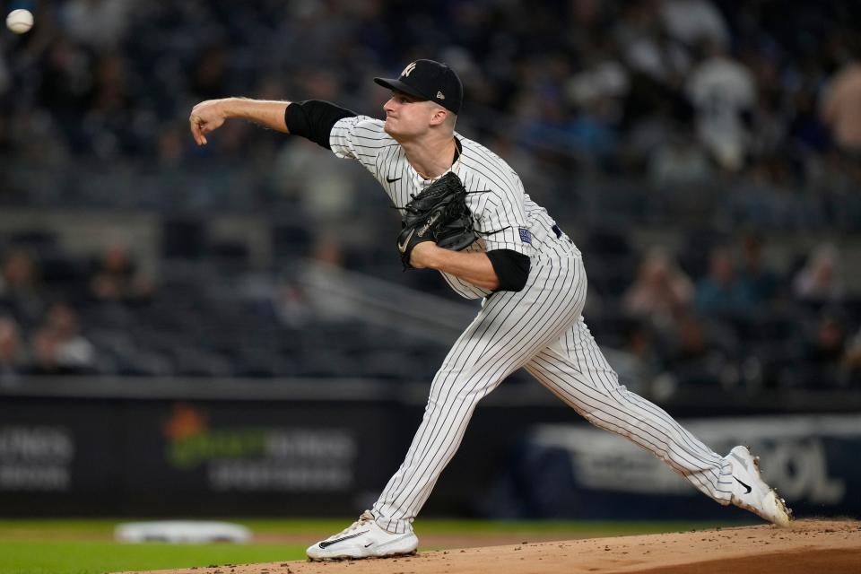 New York Yankees starting pitcher Clarke Schmidt throws to a Toronto Blue Jays batter during the first inning of a baseball game Tuesday, Sept. 19, 2023, in New York. (AP Photo/Bryan Woolston)