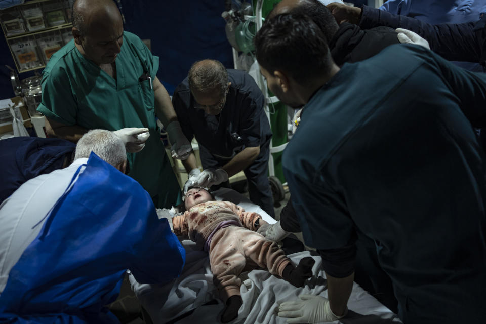 A Palestinian girl wounded in the Israeli bombardment of the Gaza Strip arrives at a hospital in Rafah on Wednesday, Dec.13, 2023. (AP Photo/Fatima Shbair)