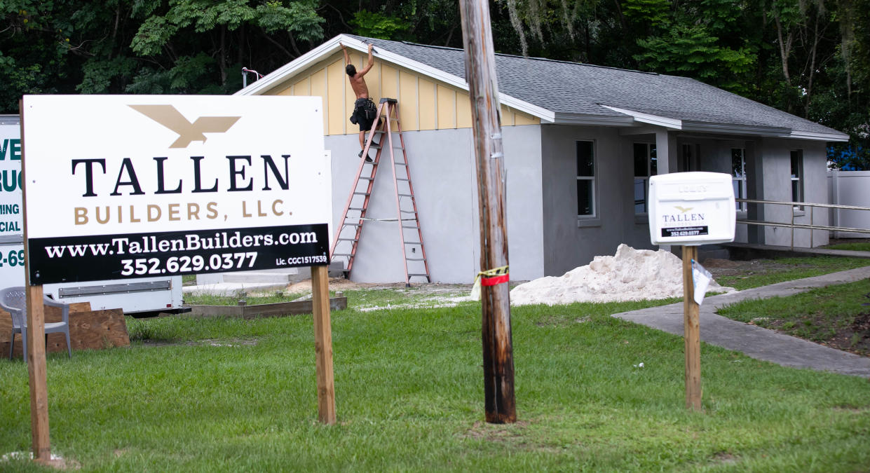 Trapper Fletcher works on Open Arms Village's new housing unit, called The Nest.