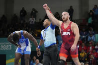 FILE - Kyle Snyder of the United States, right, celebrates after winning gold against Cuba's Arturo Silot, left, during the men's 97kg wrestling freestyle final bout at the Pan American Games Santiago, Chile, Wednesday, Nov. 1, 2023. (AP Photo/Matias Delacroix, File)