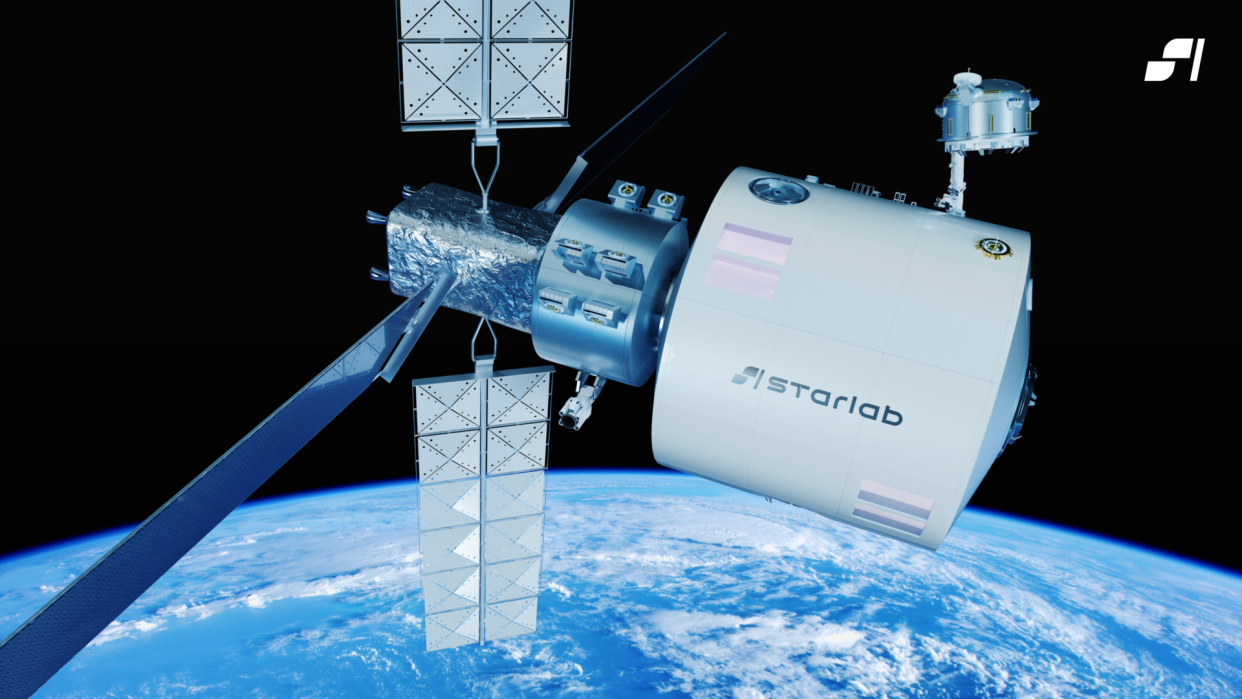  A space station floats above Earth. one end is a round white cylinder; the other is a cross-shaped arrangement of solar panels. 