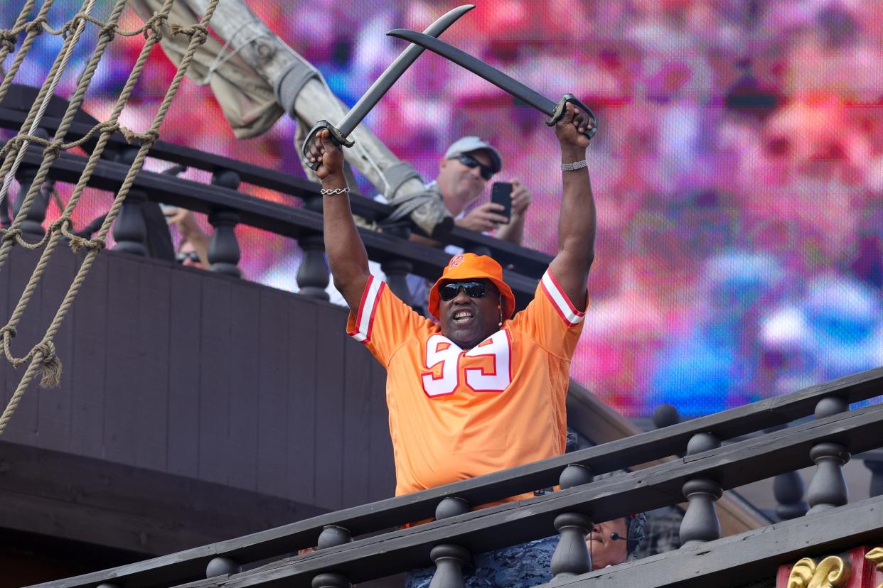 Oct 15, 2023; Tampa, Florida, USA; former Tampa Bay Buccaneer Warren Sapp hypes the fans before the start of a game against the Detroit Lions at Raymond James Stadium. Mandatory Credit: Nathan Ray Seebeck-USA TODAY Sports