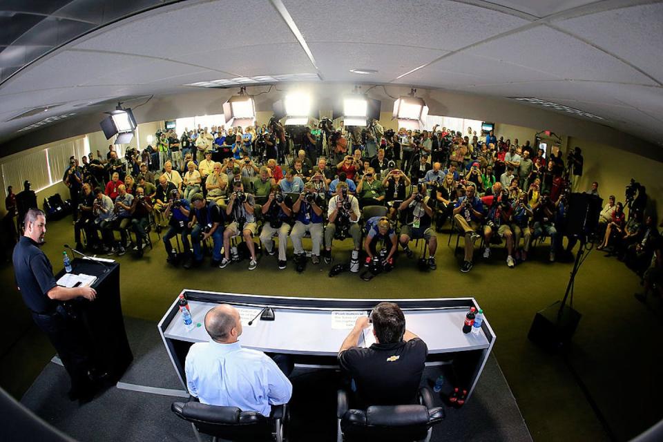 Tony Stewart, front right, speaks to the media three weeks after his car hit and killed sprint car driver Kevin Ward, Jr. during a dirt track race. <a href="https://www.gettyimages.com/detail/news-photo/tony-stewart-driver-of-the-bass-pro-shops-mobil-1-chevrolet-news-photo/454335928?phrase=kevin%20ward%20jr&adppopup=true" rel="nofollow noopener" target="_blank" data-ylk="slk:Jamie Squire/Getty Images;elm:context_link;itc:0;sec:content-canvas" class="link ">Jamie Squire/Getty Images</a>