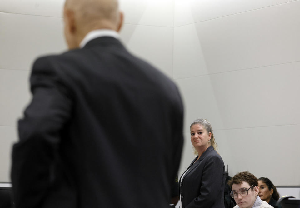 Assistant Public Defender Nawal Bashimam and Marjory Stoneman Douglas High School shooter Nikolas Cruz look towards Assistant State Attorney Mike Satz as he speaks in court during the penalty phase of Cruz's trial at the Broward County Courthouse in Fort Lauderdale, Fla., Tuesday, Sept. 13, 2022. Connor evaluated Cruz for signs of Fetal Alcohol Syndrome Spectrum Disorders. Cruz previously plead guilty to all 17 counts of premeditated murder and 17 counts of attempted murder in the 2018 shootings. (Amy Beth Bennett/South Florida Sun Sentinel via AP, Pool)