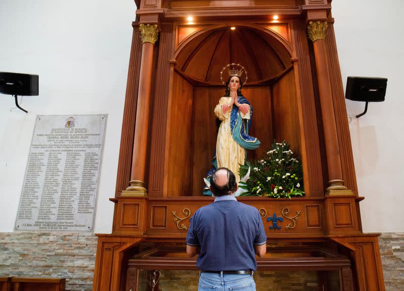 A catholic parishioner prays at the Metropolitan Cathedral, in Managua