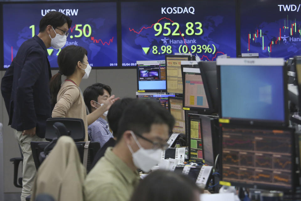 Currency traders watch monitors at the foreign exchange dealing room of the KEB Hana Bank headquarters in Seoul, South Korea, Tuesday, May 4, 2021. Asian shares were mixed Tuesday after strong corporate earnings and economic data lifted stocks on Wall Street. (AP Photo/Ahn Young-joon)