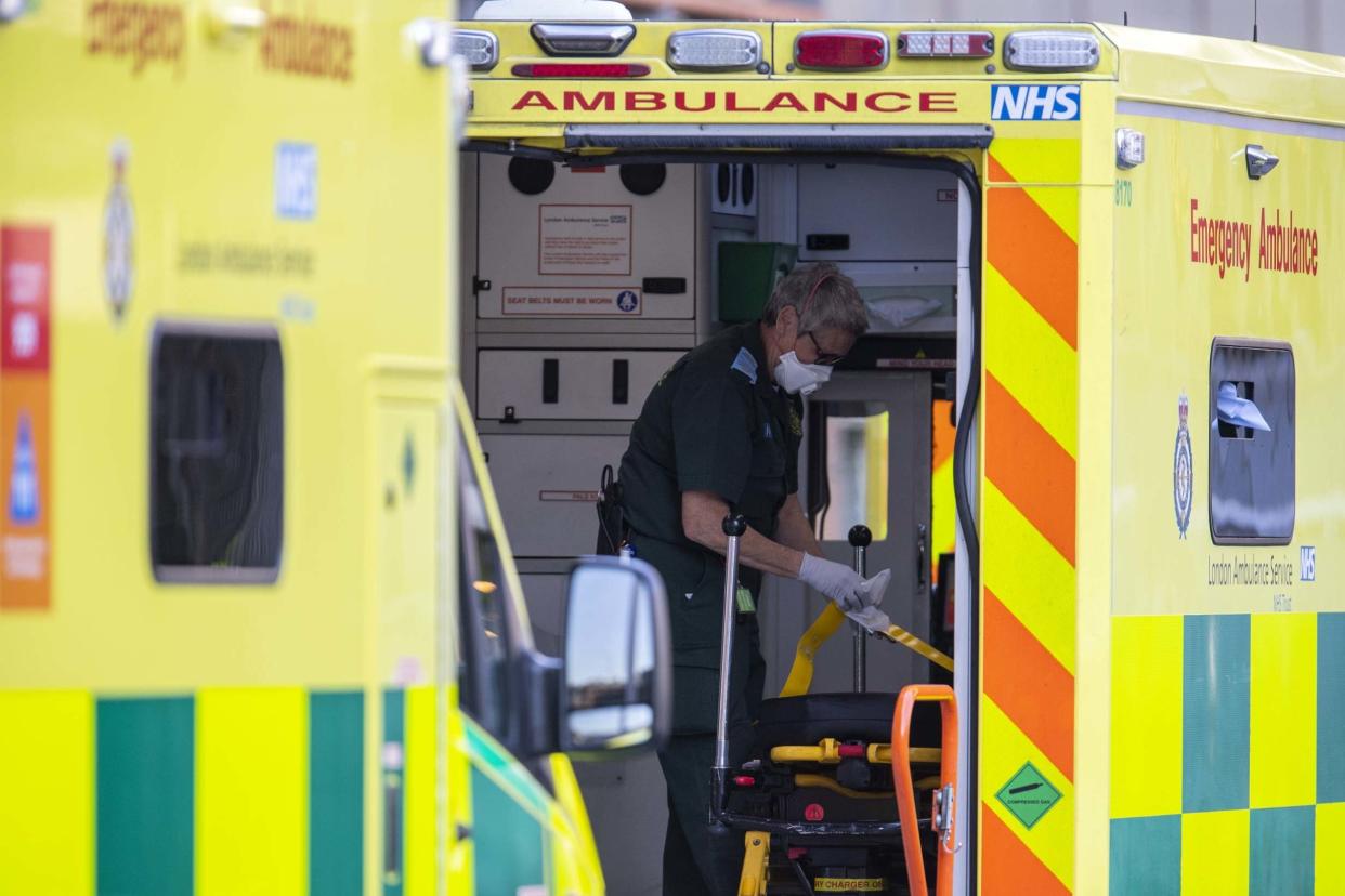 A London Ambulance worker cleans an ambulance outside of the Royal London Hospital: Getty Images