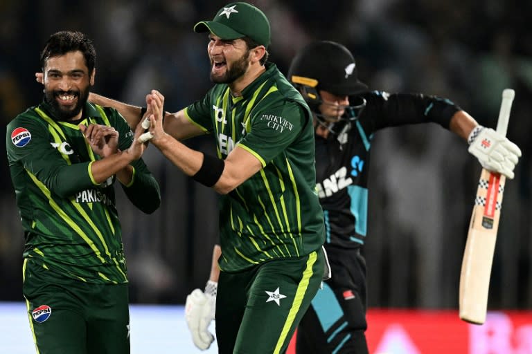 Pakistan's Mohammad Amir (L) celebrates with teammate Shaheen Shah Afridi after taking the wicket of New Zealand's Tim Robinson (R) during the second Twenty20 international cricket match between the countries in Rawalpindi on April 20, 2024 (Aamir QURESHI)