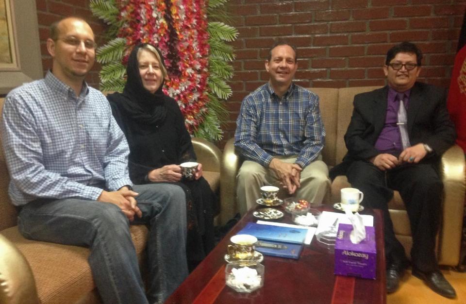 This photo taken on Tuesday, April 22, 2014, shows from left, slain American John Gabel, his mother, his father Gary Gabel sitting with Mohammad Hadi Hadayati, Kabul University's vice chancellor at Kabul University, in Kabul, Afghanistan. An Afghan police security guard opened fire on foreigners, on Thursday, April 24, 2014, as they entered the grounds of Cure International Hospital, killing three people, including pediatrician Dr. Jerry Umanos of Chicago. On Saturday, April 26, 2014, Kabul University vice chancellor Mohammad Hadi Hadayati identified the other two Americans killed in the attack as health clinic administrator John Gabel and his visiting father, Gary, also from the Chicago area. John Gabel’s wife, also an American, was wounded, Hadayati said. “We have lost a great man, a great teacher, a man who was here only to serve the Afghan people,” Hadayati said. John Gabel worked for the U.S.-based charity Morning Star Development and ran a health clinic at Kabul University, teaching computer science classes in his spare time, Hadayati said. John Gabel’s parents were visiting from Chicago, and Hadayati had lunch with the whole family the day before the attack. (AP Photo)