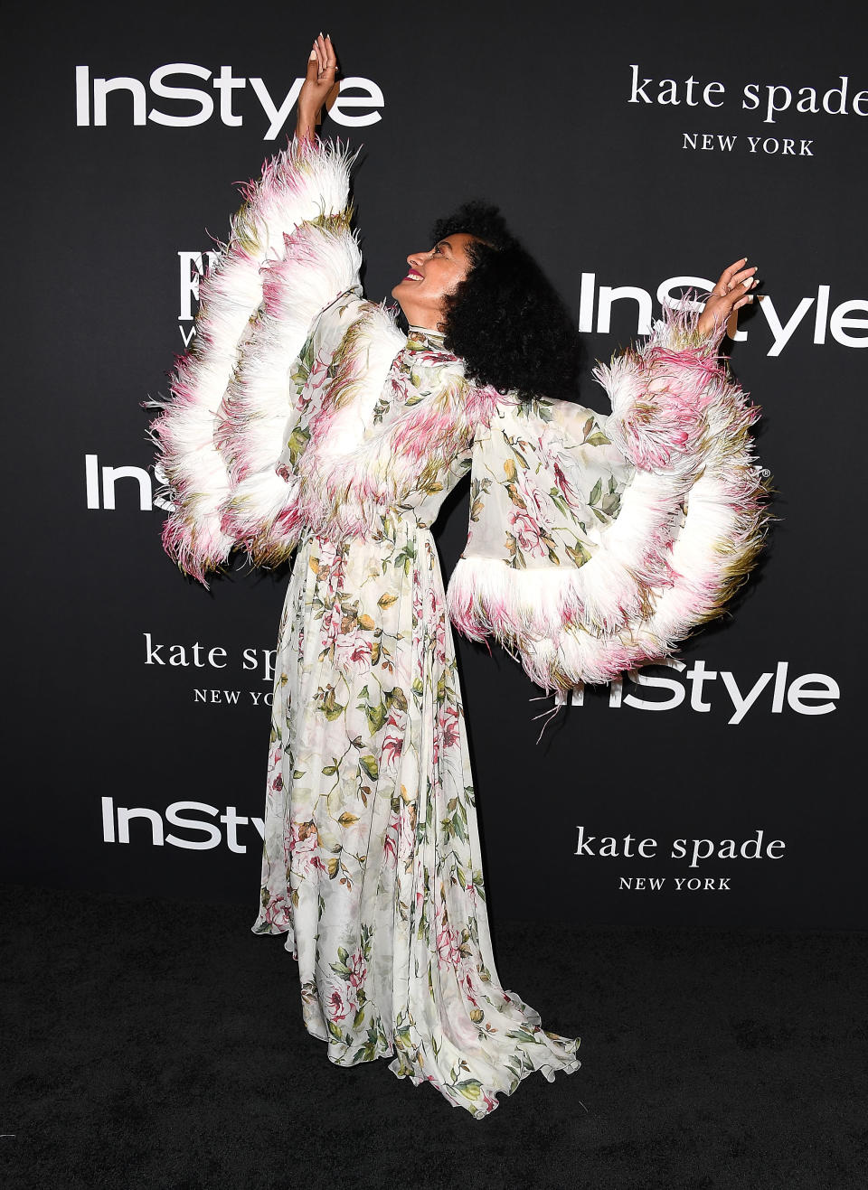 <p>‘Blackish’ actress – and Diana Ross’ daughter – Tracee always goes the extra mile with her looks. For the InStyle Awards, the American star worked a floral dress by Giambattista Valli – which she clearly enjoyed posing in. <em>[Photo: Getty]</em> </p>