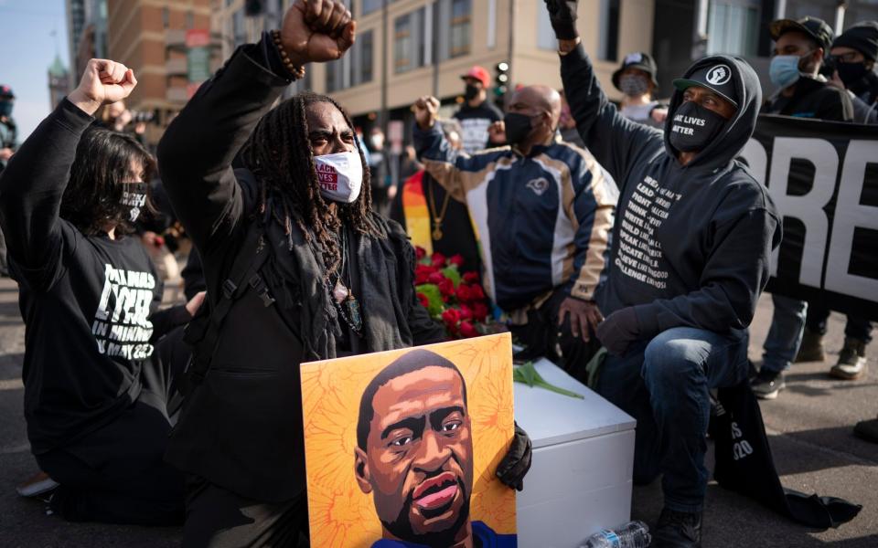 Demonstrators remember George Floyd as the jury selection for the trial of former officer Chauvin begins - AP