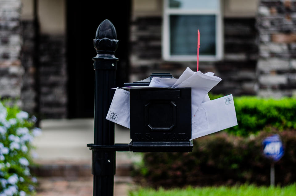 A picture of an overflowing mailbox.