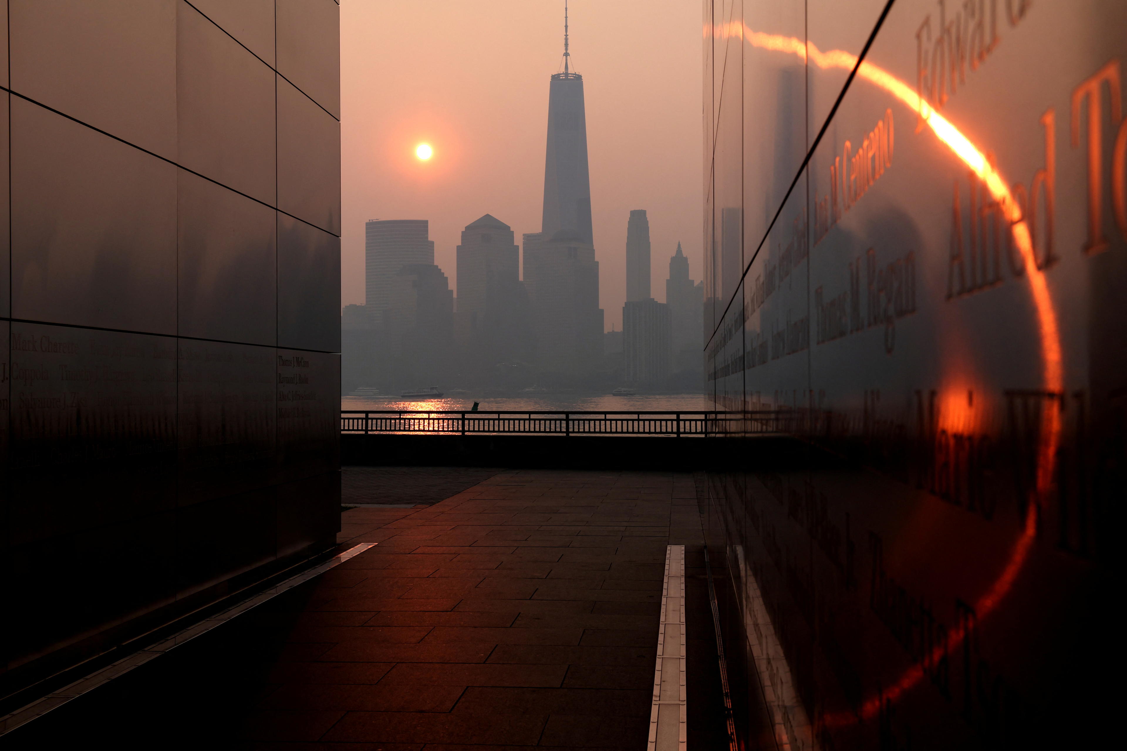 Haze and smoke caused by wildfires in Canada hang over the Manhattan skyline in June 2023.