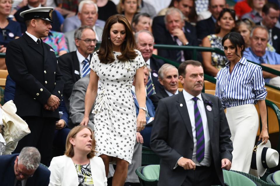 <p>Kate navigates the seats at Wimbledon, wearing a gorgeous <a rel="nofollow noopener" href="https://www.harpersbazaar.com/celebrity/latest/a22146731/kate-middleton-wimbledon-2018-dress/" target="_blank" data-ylk="slk:polka dot dress;elm:context_link;itc:0;sec:content-canvas" class="link ">polka dot dress</a>.</p>