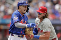 Philadelphia Phillies first baseman Alec Bohm tags out New York Mets' Tyrone Taylor during the third inning of a baseball game Tuesday, May 14, 2024, in New York. (AP Photo/Adam Hunger)
