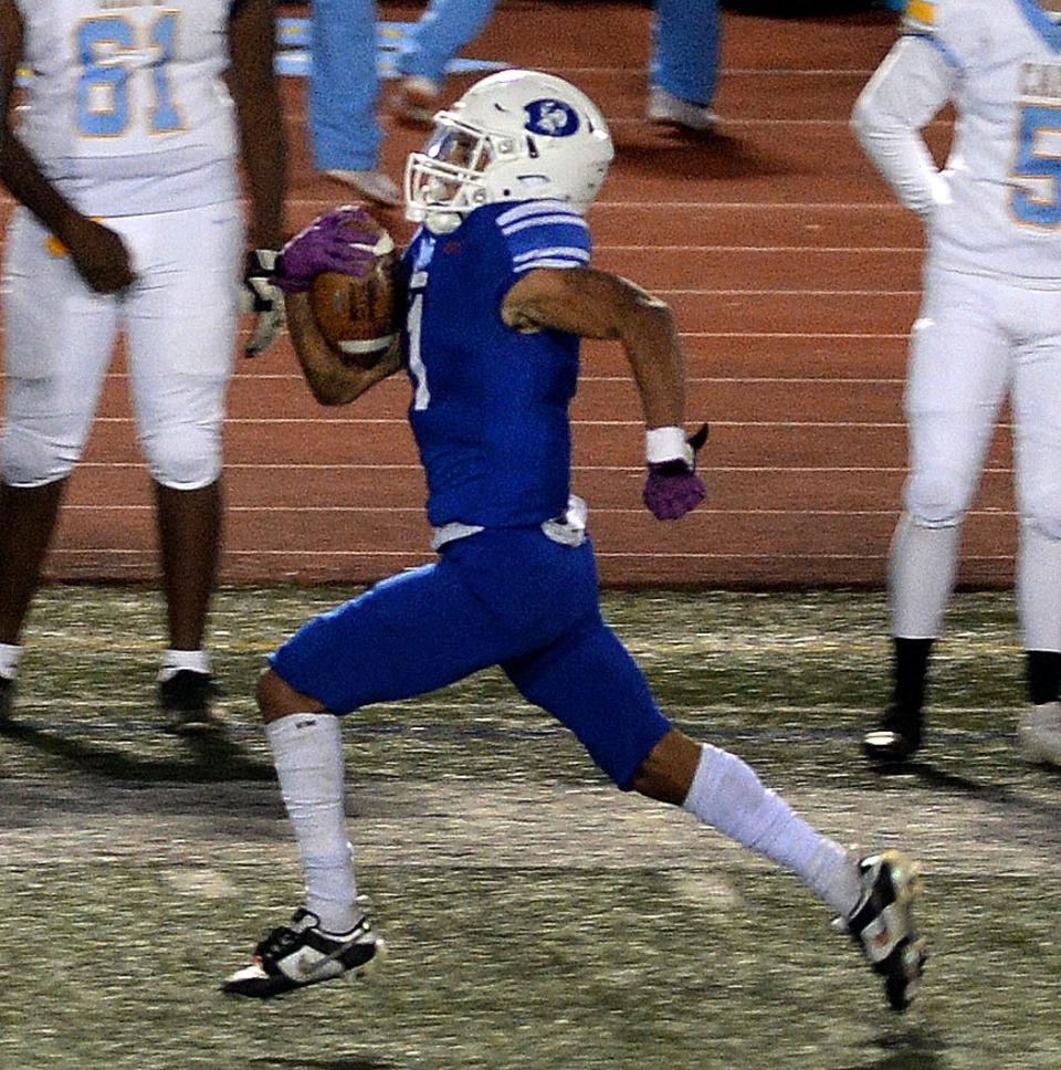 John Parker of the Senators takes a handoff 87 yards for a touchdown against Cape Henlopen Friday night.