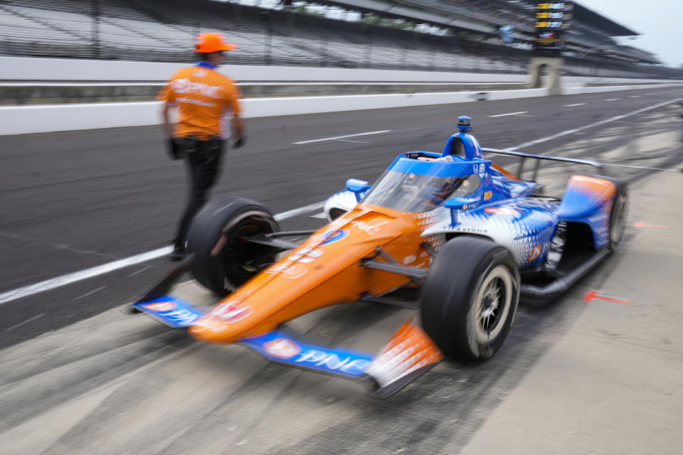 Scott Dixon, of New Zealand, drives out of the pit area during practice for the Indianapolis 500 auto race at Indianapolis Motor Speedway in Indianapolis, Friday, May 19, 2023. (AP Photo/Michael Conroy)