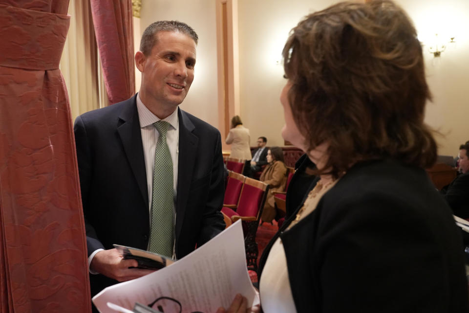 State Senate President Pro Tempore Designate Mike McGuire, left, of Healdsburg, talks with state Sen. Shannon Grove, R-Bakersfield, during the Senate session at the Capitol in Sacramento, Calif., Monday, Jan. 22, 2024. McGuire will replace current Senate Pro Tempore Toni Atkins when he is sworn-in Monday Feb. 5, 2024. (AP Photo/Rich Pedroncelli)