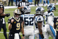 New Orleans Saints quarterback Drew Brees (9) reacts after diving over the pile for a touchdown in the first half of an NFL football game in New Orleans, Sunday, Oct. 25, 2020. (AP Photo/Brett Duke)