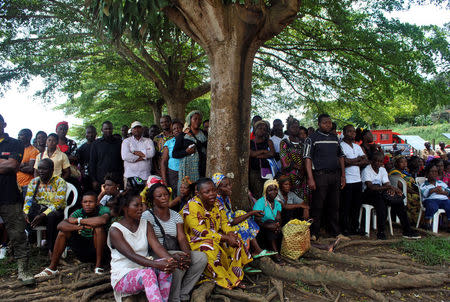 People attend an interfaith religious ceremony held near the train derailment site in Eseka, Cameroon October 24, 2016 in remembrance for those killed when a passenger train derailed. REUTERS/Stringer