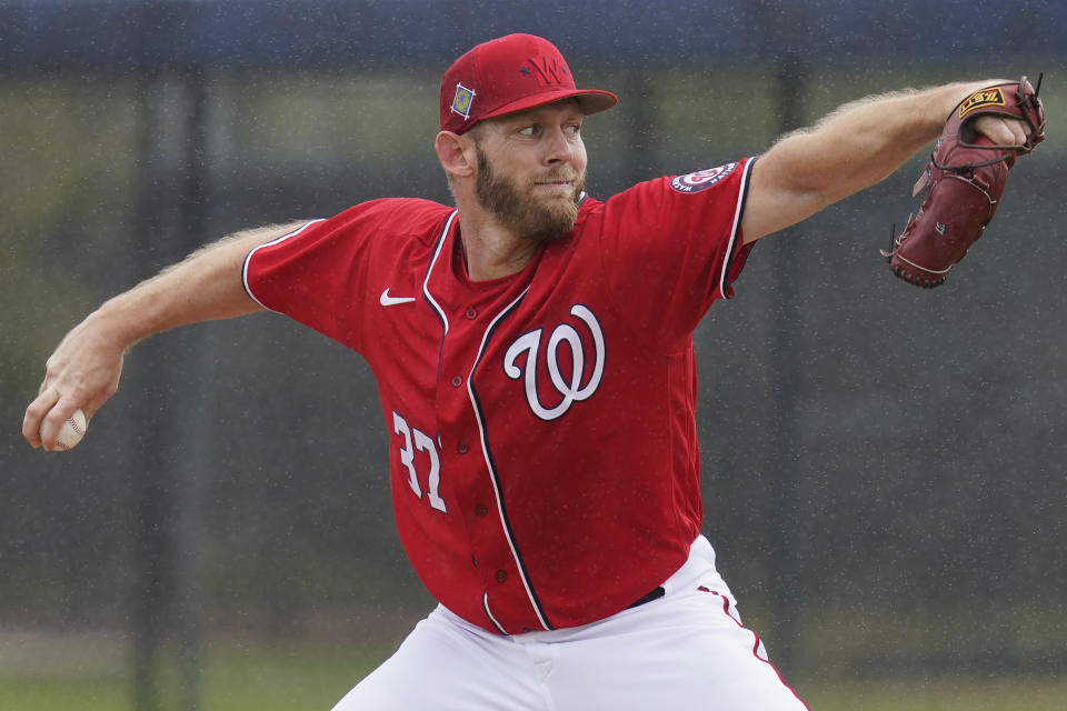 FILE - Washington Nationals pitcher Stephen Strasburg throws live batting practice in a drizzle during the team's spring training baseball workout March 15, 2022, in West Palm Beach, Fla. Strasburg, the 2019 World Series MVP whose career was derailed by injuries, officially was listed by Major League Baseball on Saturday, April 6, 2024, as being retired. (AP Photo/Sue Ogrocki, File)