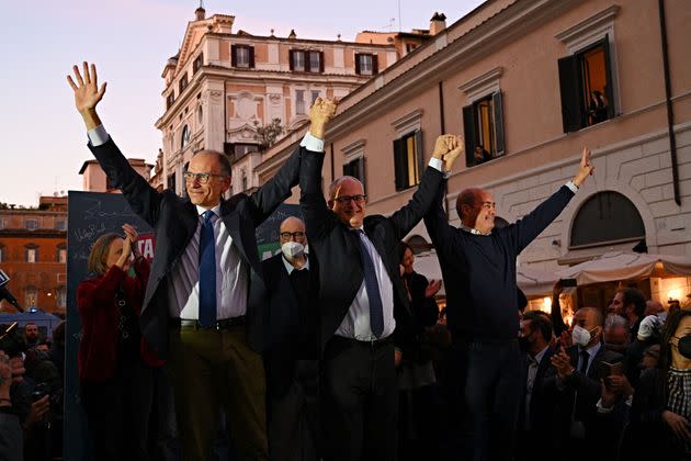Rome's newly elected mayor, centre-left candidate of the Democratic Party (PD), Roberto Gualtieri (C) celebrate with PD's general secretary Enrico Letta (L) and Presdient of the Latium region Nicola Zingaretti, as he celebrates his victory with supporters in Rome on October 18, 2021. - With counting complete in more than 92 percent of polling stations, Roberto Gualtieri was leading with more than 60 percent over Enrico Michetti, a lawyer and local talk radio host with no prior political experience. (Photo by ANDREAS SOLARO / AFP) (Photo by ANDREAS SOLARO/AFP via Getty Images) (Photo: ANDREAS SOLARO via Getty Images)