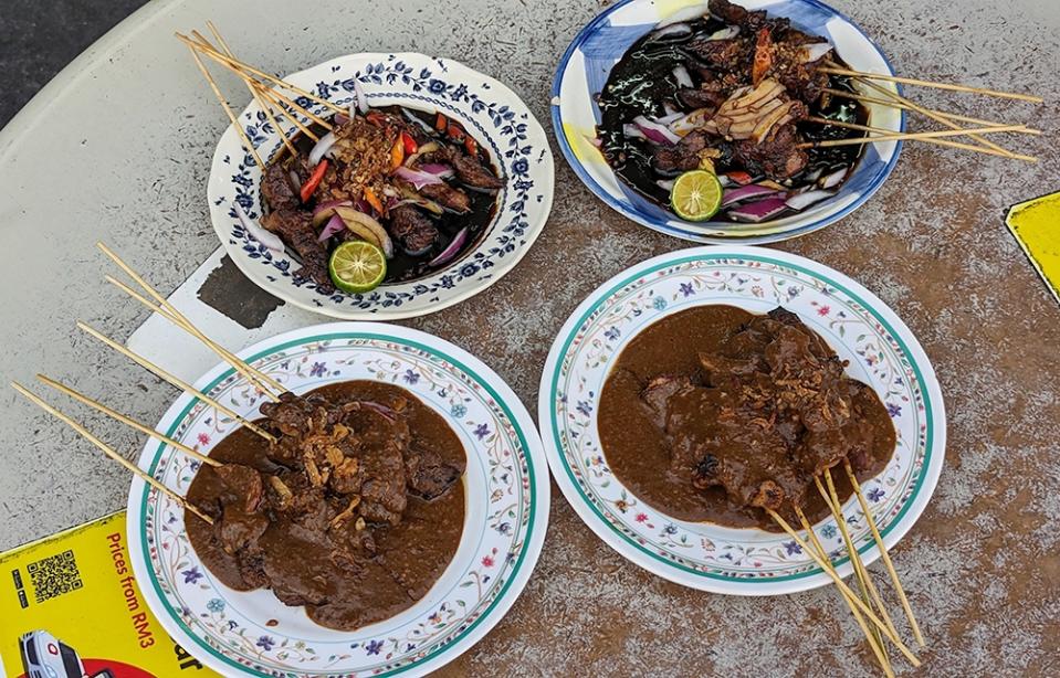 Clockwise from top right: 'sate itik', 'sate ayam', 'sate lembu' and 'sate kambing'.