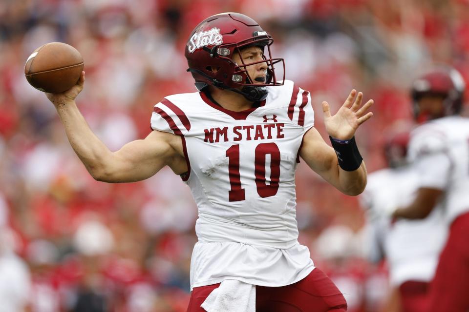 Sep 17, 2022; Madison, Wisconsin, USA; New Mexico State Aggies quarterback Diego Pavia (10) throws a pass during the first quarter against the Wisconsin Badgers at Camp Randall Stadium. Mandatory Credit: Jeff Hanisch-USA TODAY Sports