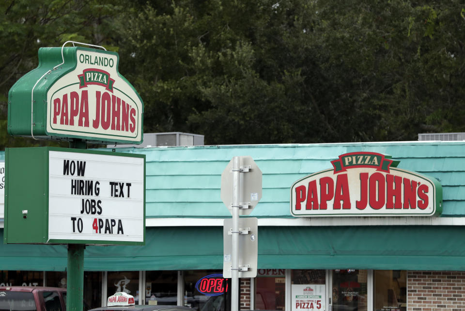 In this Monday, Nov. 4, 2019 photo a job posting for a Papa John's Pizza restaurant is seen in Orlando, Fla. (AP Photo/John Raoux)