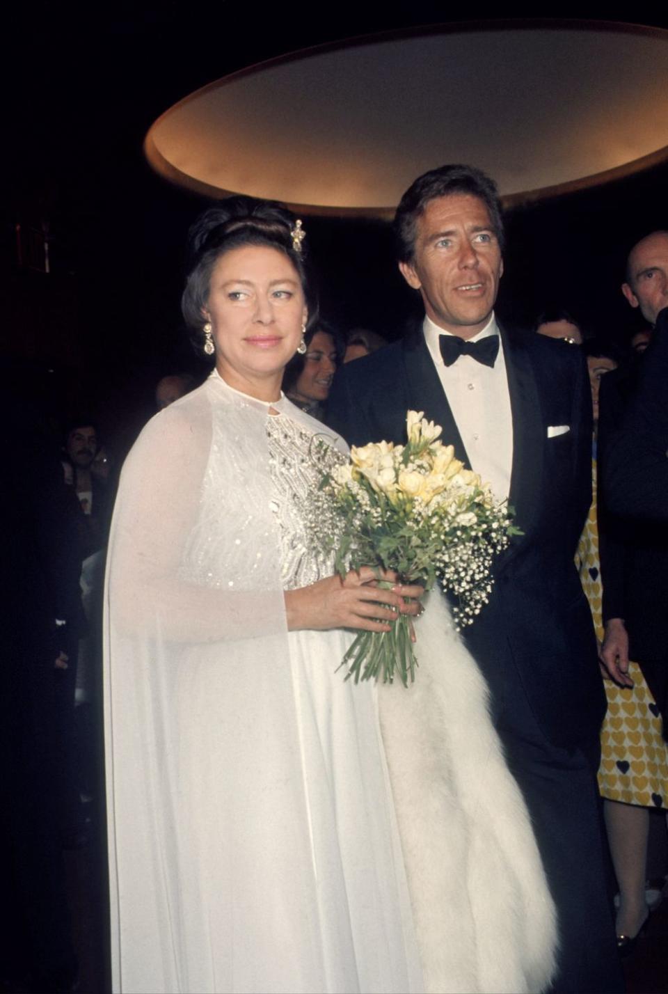 <p>Princess Margaret and Antony Armstrong-Jones attend the Royal Ballet at the Met in New York City, circa May 1974. The Princess wears a sheer cape over an embellished gown.</p>