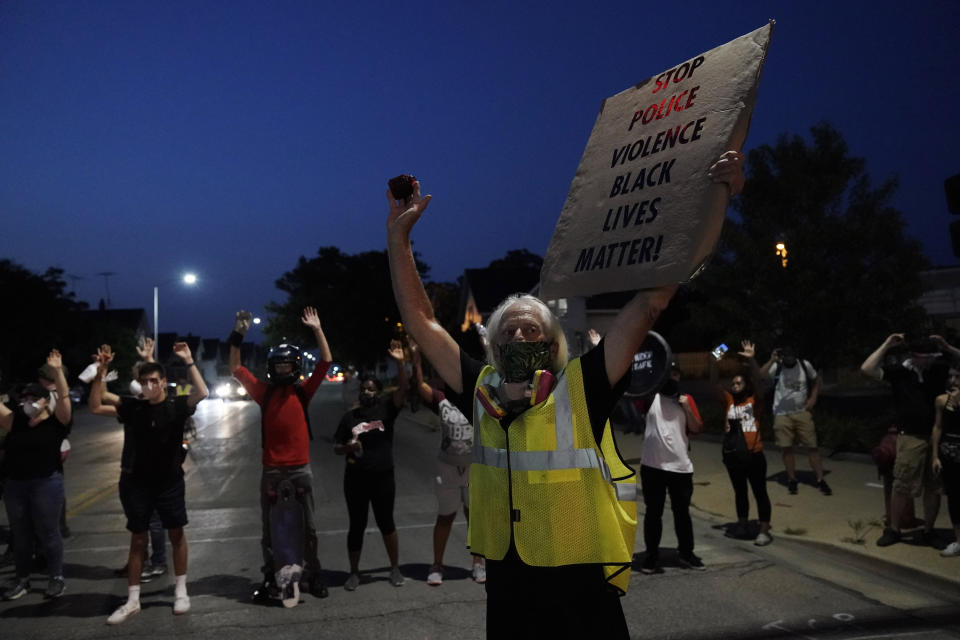 People gather to protestWednesday, Aug. 256 2020 in Kenosha, Wis. Anger over the Sunday shooting of Jacob Blake, a Black man, by police spilled into the streets for a fourth night. (AP Photo/Morry Gash)